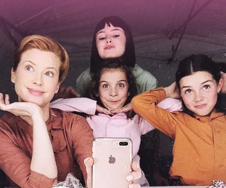 Lilly Aspelll with friends on movie set