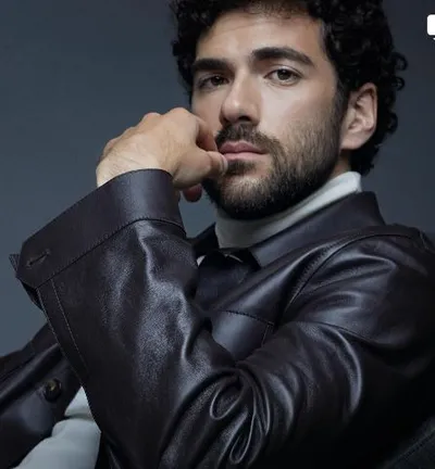 Actor Andrea Di Luigi wearing a black leather jacket