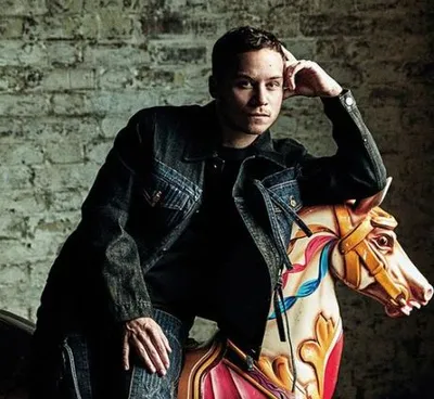 Actor Finn Cole wearing black jacket and black jeans