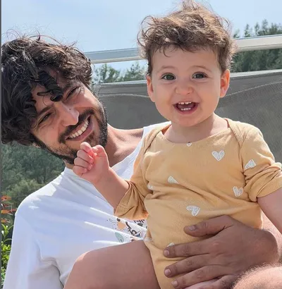 Actor Taner Ölmez having fun with his son