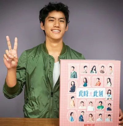 Actor Berant Zhu holding countdown calendar netflix gift box