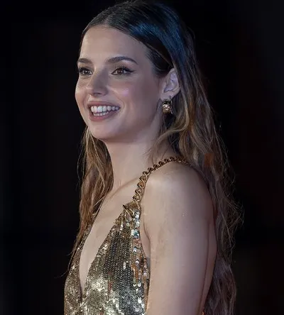 Actress Federica Sabatini seen in a golden colored sleeveless top