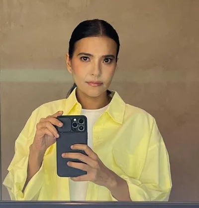 Actress Alessandra De Rossi seen taking selfie in white inner and yellow shirt