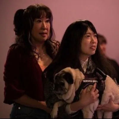 Awkwafina and Sandra Oh seen with their dog