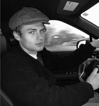 Actor Noah LaLonde sitting in a jeep wearing a black suit