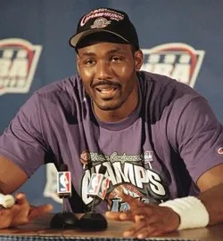 Karl Malone sitting and talking about the game
